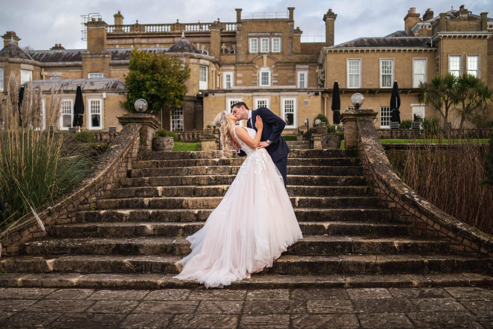 The beautiful bride Amelia in a Brides of Southampton wedding dress with her husband at Chilworth Manor, Hampshire for a bridal photoshoot