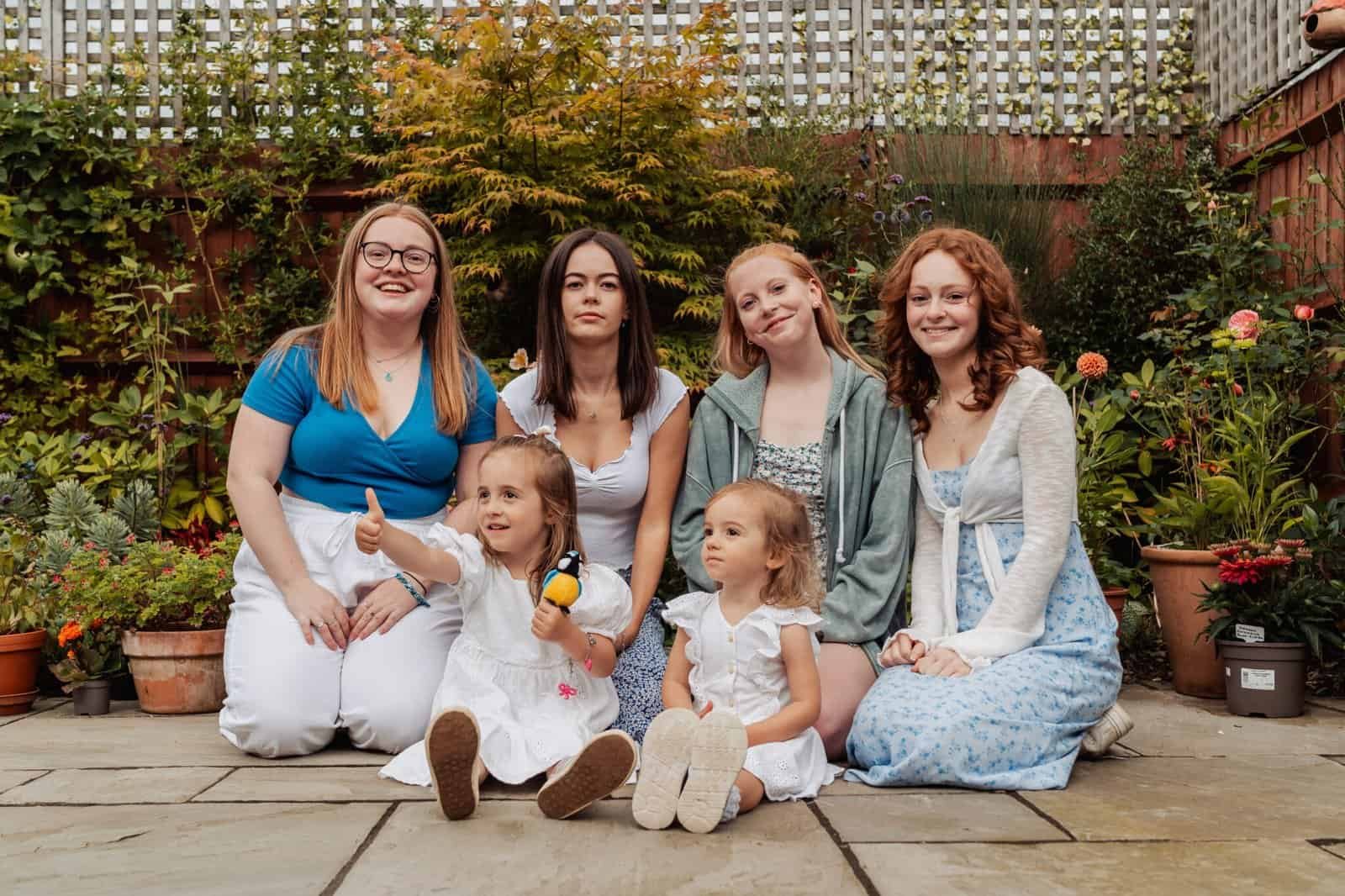 Family group photographed in a garden at a celebration