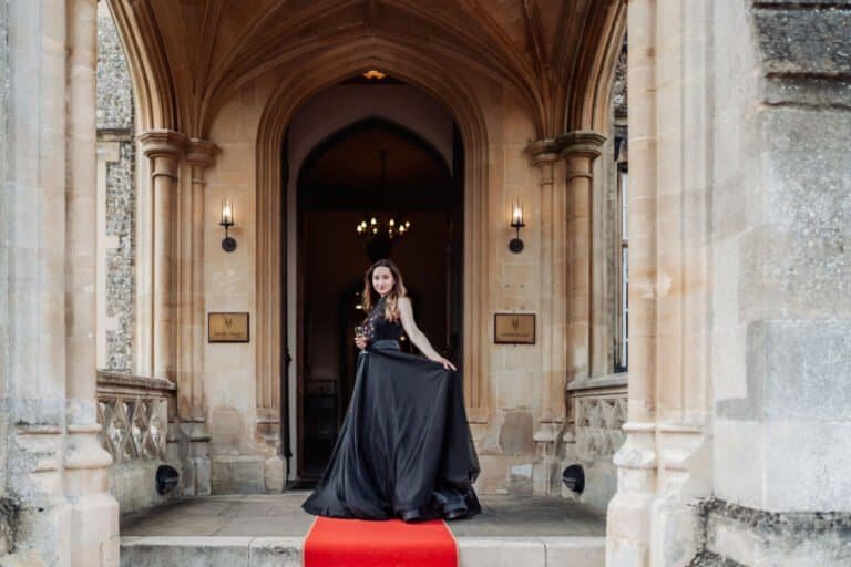 Bride standing in the arched doorway at Horsley Towers