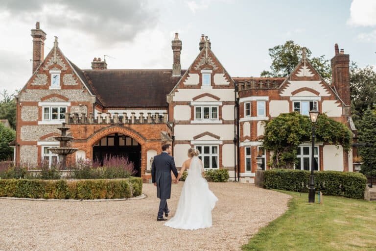 Bride in front of Kingswood Manor on her wedding morning