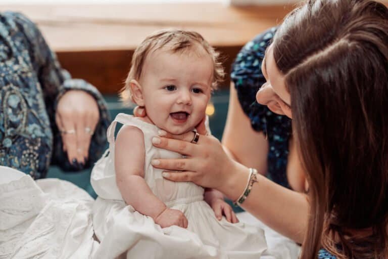 Baby being dressed before the naming ceremony begins